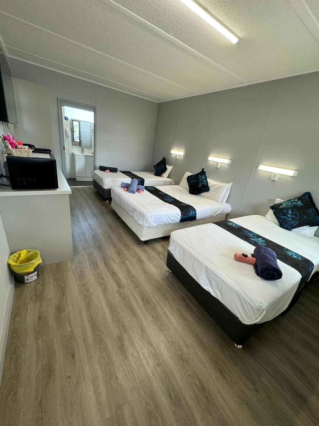 Bright fully renovated motel room with fresh beds